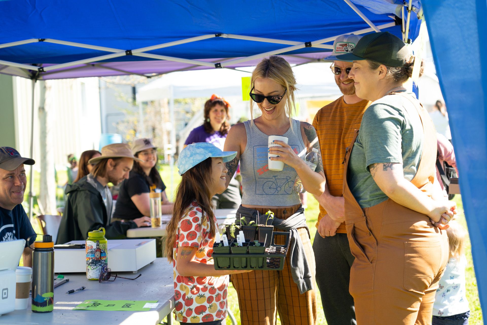 Family at Louisville Grows table