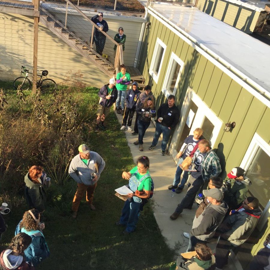 Volunteers huddling at Healthy House