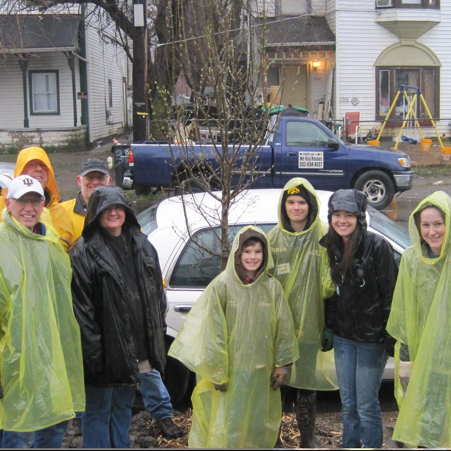 Volunteers planting trees in the rain